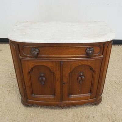 1035	WALNUT VICTORIAN MARBLE TOP WASHSTAND W/CARVED LEAF & NUT PULLS, MISSING BACK SPLASH, APPROXIMATELY 55 IN X 19 IN X 31 IN
