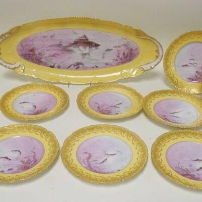 1064	THEADORE HAVILAND LIMOGES FISH SET, PLATTER W/12 PLATES, ONE PLATE W/RIM CHIP, PLATTER 24 IN X 10 IN, PLATES 9 IN, J MARTIN
