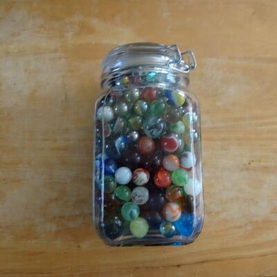 LARGE JAR OF MARBLES.