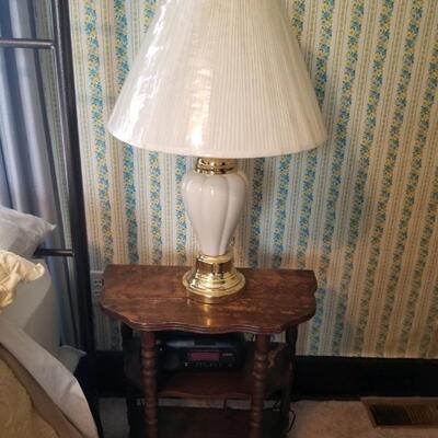 Well worn small table, lamp