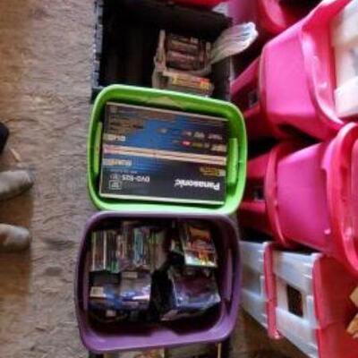 #9520 â€¢ 5 Totes Of Movies, VHS, Playstation Games, And More.