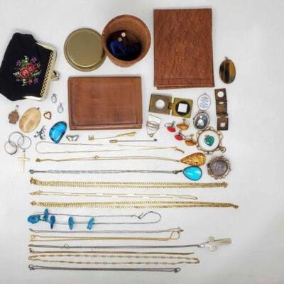 #1002 â€¢ Costume Jewelry Lot and More. Includes: Wallets, Necklaces, Pendants, Earrings and More Ring Sizes: 61/2- 91/2. 