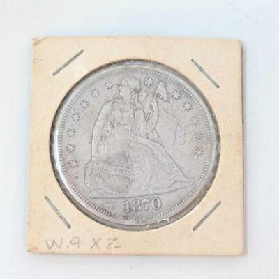 #1190 • 1870 Seated Liberty Silver Dollar.