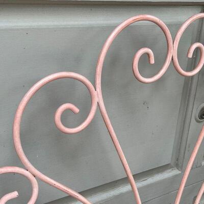 WROUGHT IRON BED FRAME | Pink scrollwork iron headboard; h. 41 x 39 in.