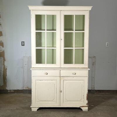 COUNTRY PAINTED CABINET | Double glazed doors over two drawers and cabinet doors, white paint with green painted interior; h. 76 x 43-1/2...