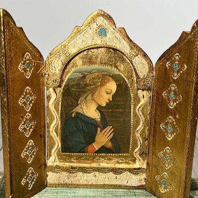MINIATURE SHRINE | Shrine in three panels, showing a portrait of a young woman in prayer, gilt and paint decorated with a green velvet...