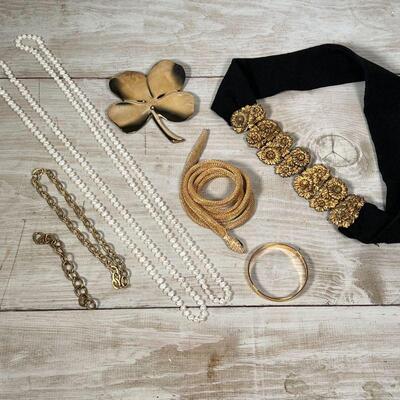 COSTUME JEWELRY | Including a snake-form necklace, a choker, gold-toned bracelets, a lucky four leaf clover pin, etc.