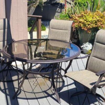 Patio Furniture/ Swivel Chairs 4, table, umbrella, chaise lounge.