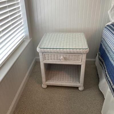 One of TWO wicker end tables.  Glass top. One drawer. Sold separately. 20