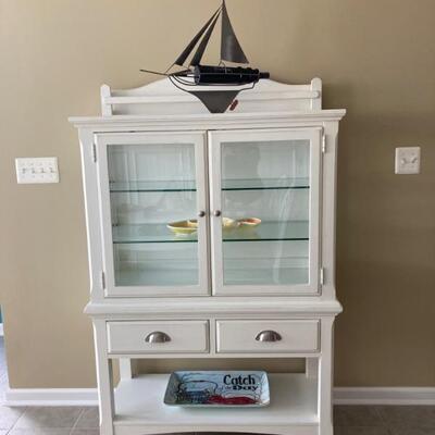 Glass front cabinet measures 39