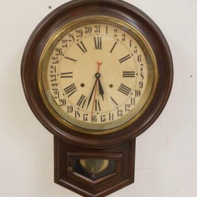 1009	ANTIQUE WALNUT SPRING WOUND CALLENDAR CLOCK, APPROXIMATELY 17 1/2 IN X 24 IN HIGH
