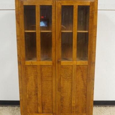 1288	BENCH MADE MAPLE & TIGER MAPLE TWO DOOR NARROW CUPBOARD W/ LOWER PANELED SIDES W/ THREE SHELVES APP. 47 IN X 16 IN X 76 I N H 
