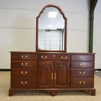 1043	HARDEN SOLID CHERRY CHEST, 8 DRAWER, 2 DOOR CONCEALING 2 DRAWERS W/MIRROR APPROXIMATELY 68 IN X 19 IN X 79 IN HIGH
