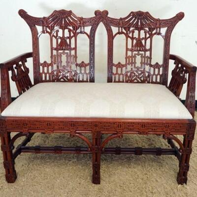 1105	MAHOGANY ASIAN LOVE SEAT WITH CARVED PAGODA CREST AND ARMS, APPROXIMATELY 46 IN X 23 IN X 38 IN
