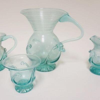 1260	FOUR PIECE LOT OF BLOWN GLASS FROM LIBERTY VILLAGE, THREE PITCHERS & A SMALL BOWL. LARGEST PIECE APP. 9 IN 
