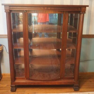 1103	BEAUTIFUL EMPIRE BOW FRONT MAHOGANY CHINA CLOSET WITH CORTHINTIAN COLUMNS, CLAW FEET, MIRROR BACK AND CONSEALED TOP DRAWER....
