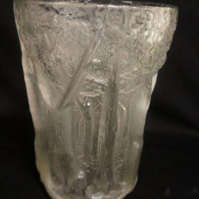 1205	LARGE FROSTED GLASS VASE EMBOSSED W/ TREES ALL AROUND. APP. 10 1/4 IN H 
