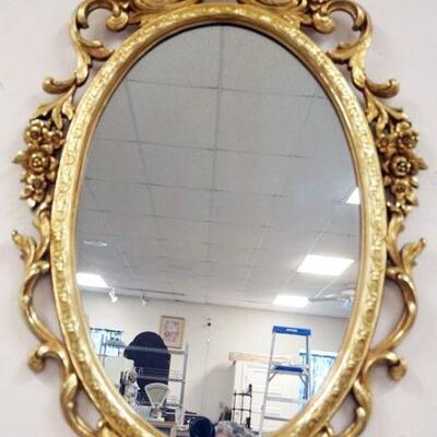 1114	ORNATE SYROCO OVAL MIRROR IN COMPOSITE FRAME, APPROXIMATELY 37 IN X 21 IN
