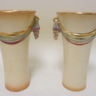 1183	PAIR OF ART DECO POTTERY VASES W/ MULTI COLORED SWAGS & GILT RIMS. APP. 10 IN 
