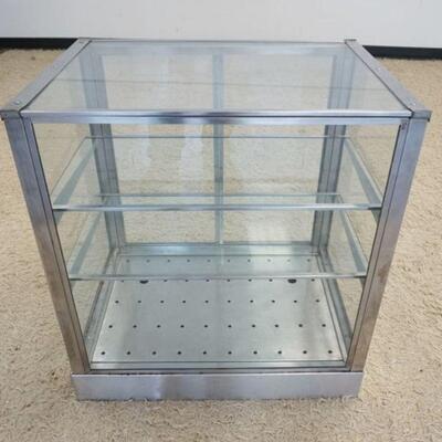 1100	NICKLE PLATED GLASS STORE TOP COUNTER CASE W/DRAWER AT BASE, APPROXIMATELY 28 IN X 21 IN X 30 IN HIGH
