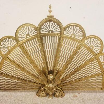 1198	BRASS FIREPLACE PEACOCK SCREEN W/ WINGED GRIFFIN AT BASE APP. 25 IN H 
