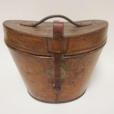 1269	ANTIQUE LEATHER HAT BOX W/ TOP HAT. APP 11 IN HIGH A.J. WHITE HATTER & CAPMAKER 74863 JERMYN ST. ST. JAMES
