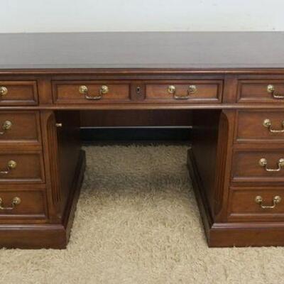 1059	HEKMAN OFFICE DESK, 8 DRAWER, MAHOGANY W/FILE DRAWER, APPROXIMATELY 66 IN X 34 IN X 30 1/4 IN HIGH
