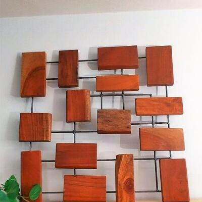 One of a pair of Marcel Marcel Teak Wall Art from Crate and Barrel