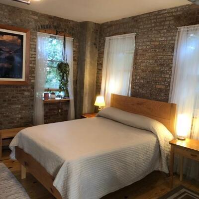 Queen. Headboard is curly red oak (kinda unusual) and white oak. Foot is rustic red oak. Under structure is ash. No box spring. Plywood...