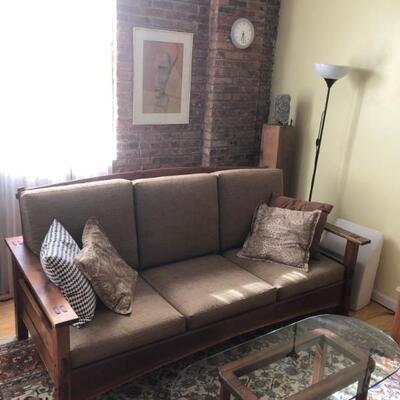 Sofa is walnut with ebony accents. 83â€ long. Table is mahogany with glass