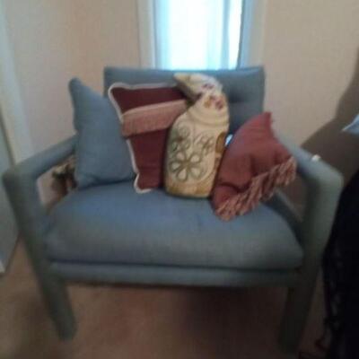Aqua armchair with pillows
