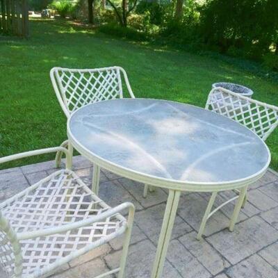 White patio set with glass table