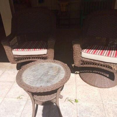 Patio furniture  and roud table with striped cushions