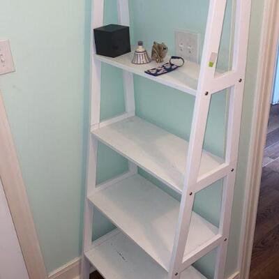 white wooden  ladder shelf 