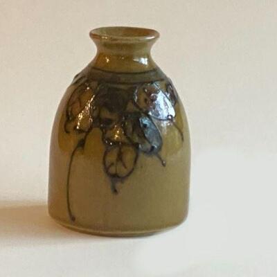 Olive salt glaze vase 
Olive colored base
Black leaves slip-glazed on vase 
Made in Japan