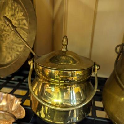 I had to look this up to find out what it is... It's a brass and copper smudge pot.  It's a fire starter.  Doesn't look like its ever...