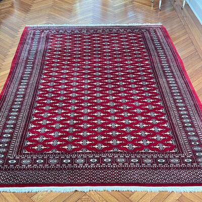 HAND-WOVEN PAKISTANI RUG | Overall pattern with medallion border, wool, very good pile, in overall very good condition, with staining to...