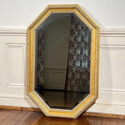 OCTAGONAL WALL MIRROR | Carolina Mirror Company, beveled glass octagonal mirror in a gilt frame; 35 x 23 in.