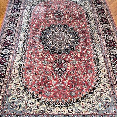 HAND-WOVEN AREA CARPET | Handmade Pakistani rug with central medallion on an oval ground within floral patterned borders, appearing in...