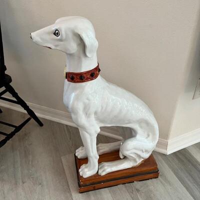 Ceramic dog depicting a sitting greyhound
approximately 36â€ tall
