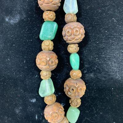 carved wooden beaded necklace with ancient glass