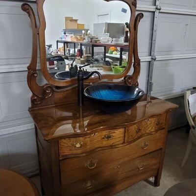 Antique dresser made into bathroom vanity