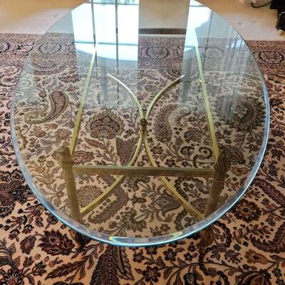 Glass Top Coffee Table With Metal Frame  https://ctbids.com/estate-sale/16657/item/1620287