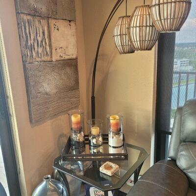 floor lamp, end table and wall art
