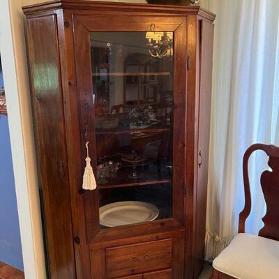 Primitive corner cabinet