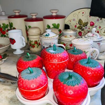 LOTS OF STRAWBERRY ITEMS, COOKIE CONTAINERS, GLASSES, PLATES, STORAGE CANISTERS, YOU NAME IT AND IF IT'S STRAWBERRY, IT MAY BE AT THIS SALE