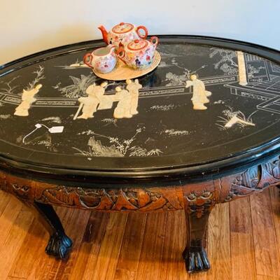 HAND CARVED OVAL COFFEE TABLE WITH MOTHER OF PEARL AND LOTS OF DETAIL