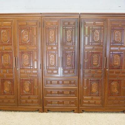 1134	ASIAN ROSEWOOD CARVED 3 SECTION WARDROBE WALL UNIT, APPROXIMATELY 109 IN X 28 IN X 79 IN HIGH
