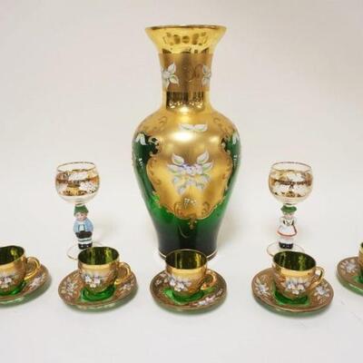 1018	LOT OF EMERALD GREEN ENAMELED DECORATED GLASS INCLUDING VASE, 5 CUPS W/SAUCERS & 2 FIGURAL GERMAN WINES, VASE IS APPROXIMATELY 14...
