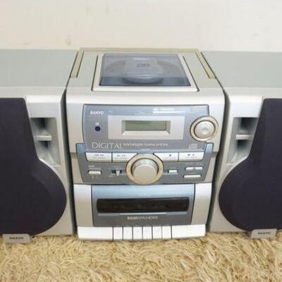 1213	SANYO CD, CASSETTE, TUNER PLAYER, POWERS UP, NO FURTHER TESTING, SOLD AS IS, APPROXIMATELY 25 IN X 9 IN X 11 IN HIGH
